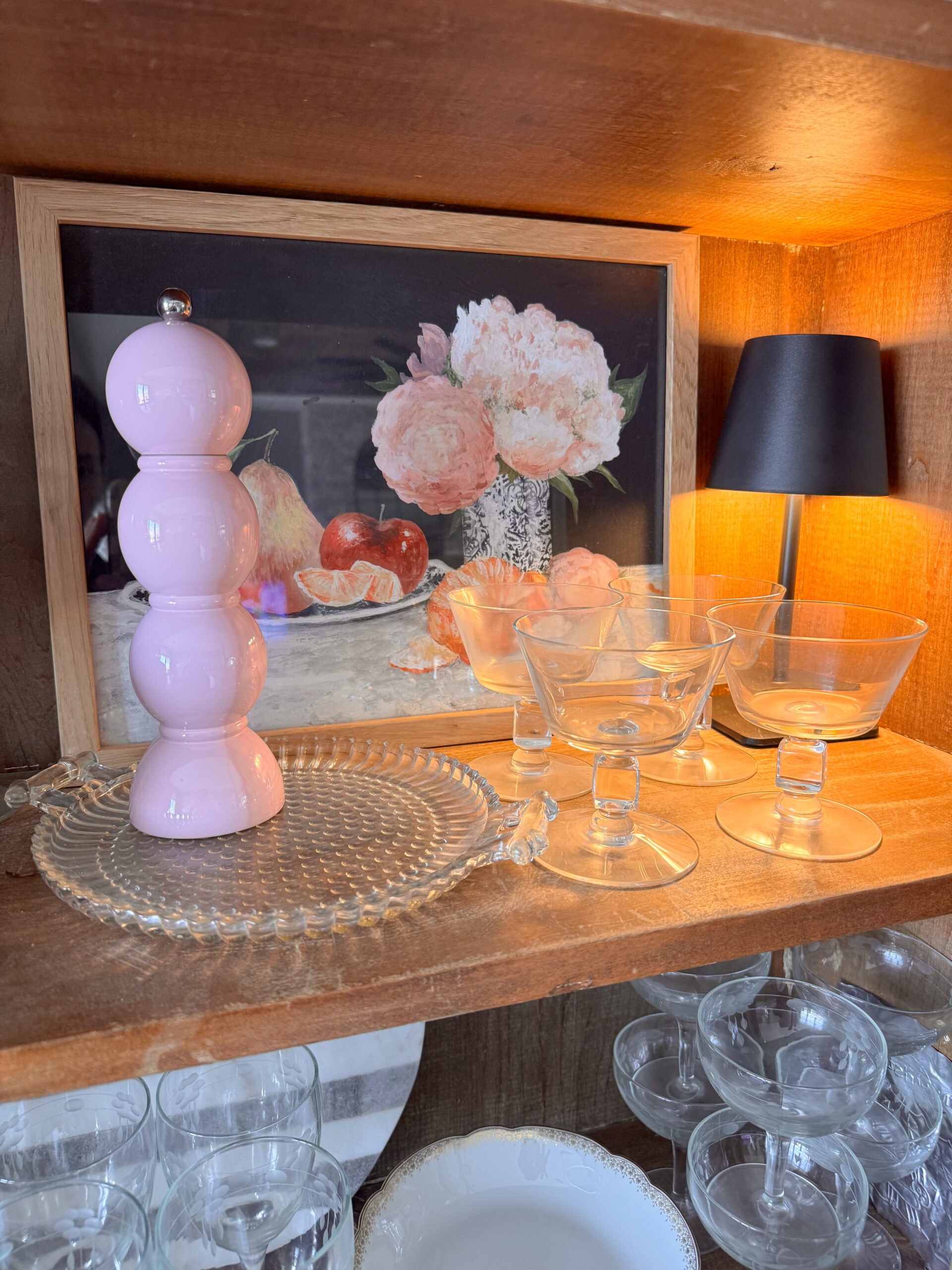 artwork, glasses, lamp, and salt mill