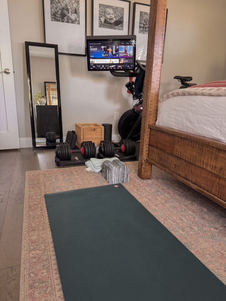 swiveled Peloton screen in small space home gym