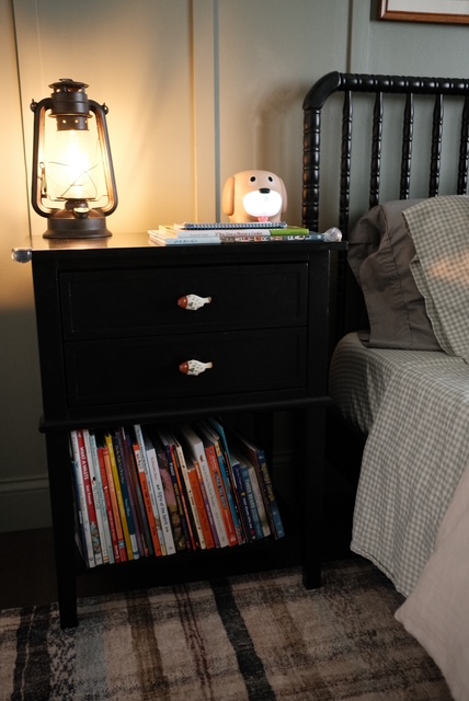 nightstand in cozy vintage boys bedroom