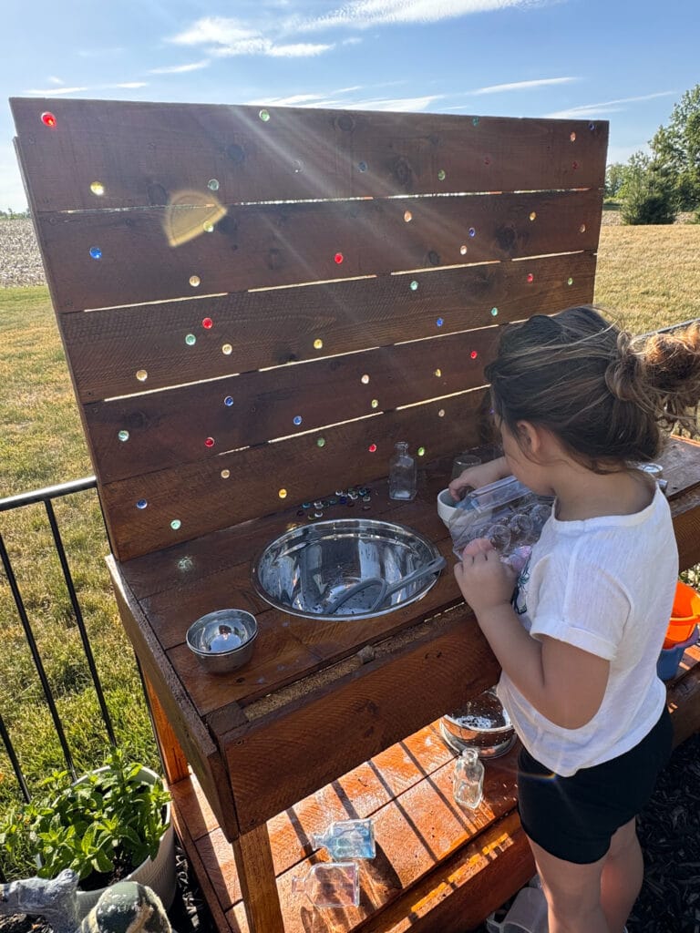 marbles in DIY mud kitchen